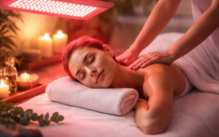 Red light therapy device used during a massage session at Cloud 9 Foot Spa